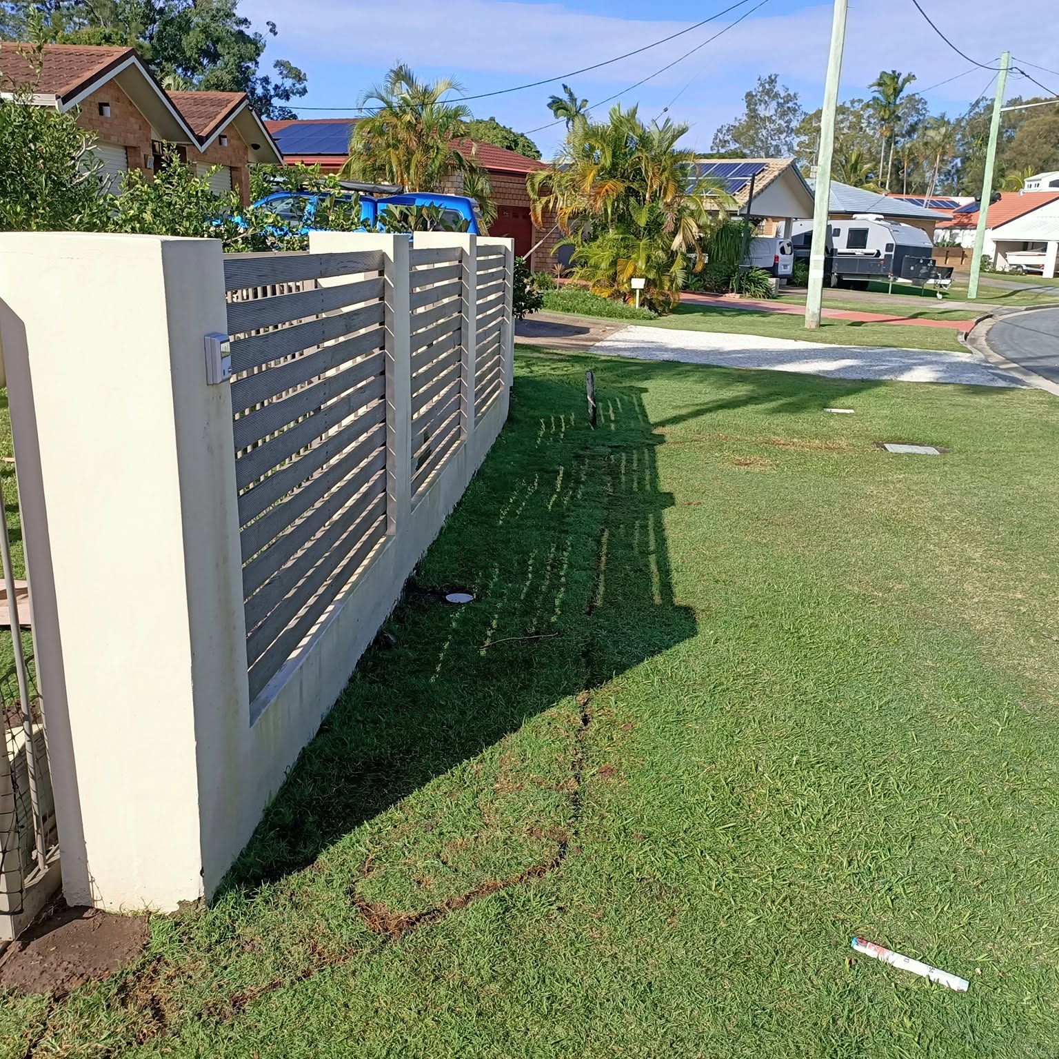 The same front lawn with the turf relaid after the pipework went in